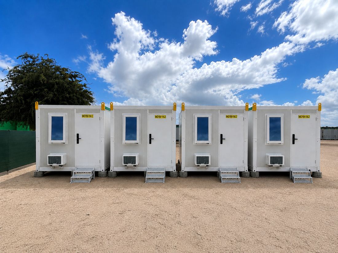 Row of four foldable accommodation units deployed on site